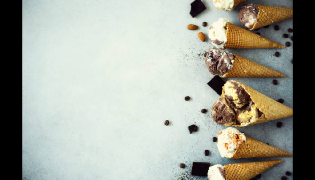 chocolate-and-coffee-ice-cream-in-waffle-cone-with-coffee-beans in grey background