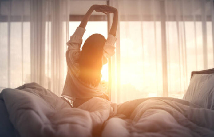 Woman Waking up in morning