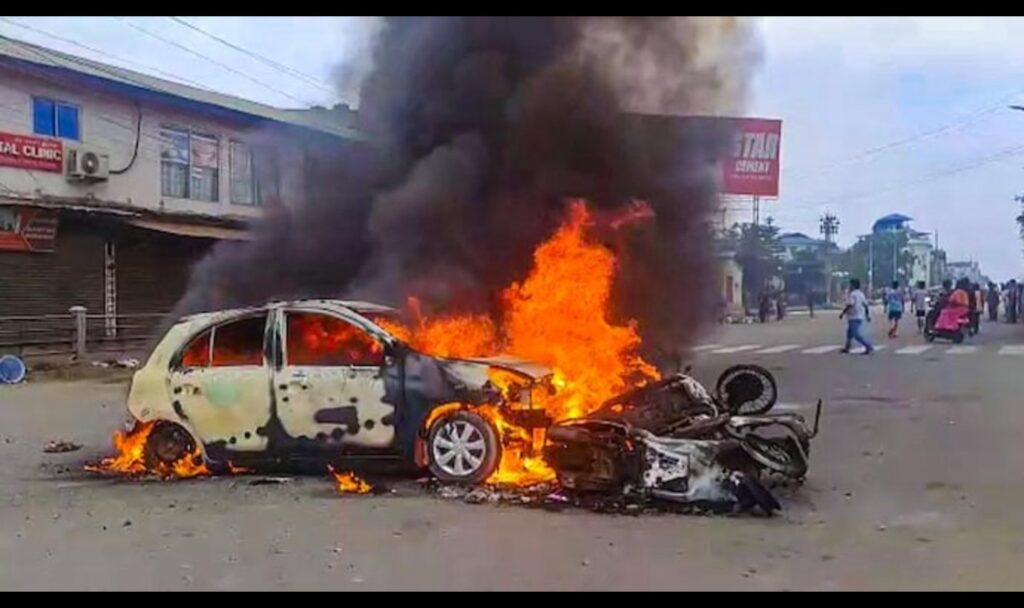 Car burning in middle of road