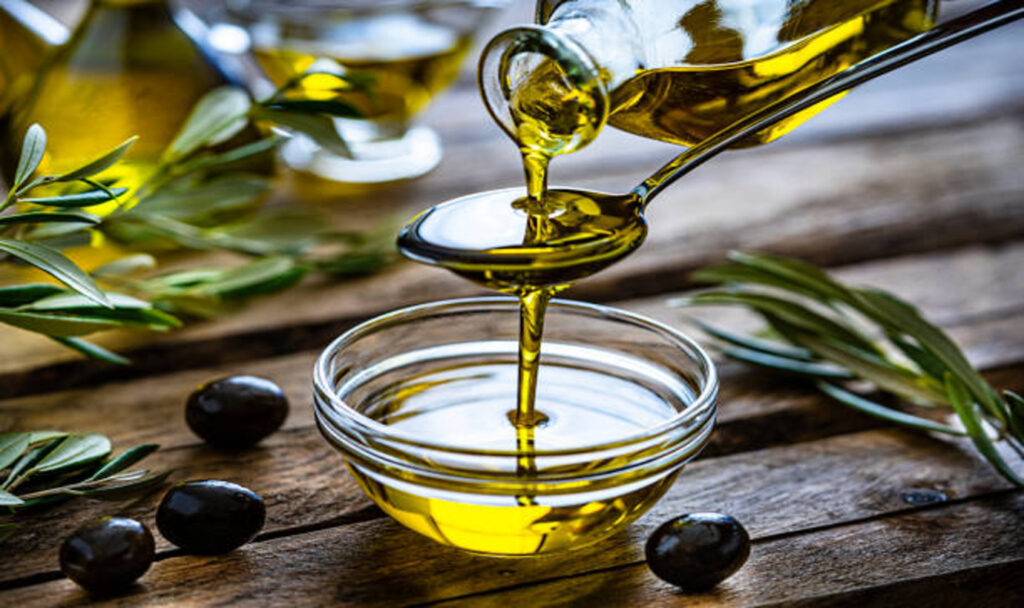 Pouring oil in a bowl