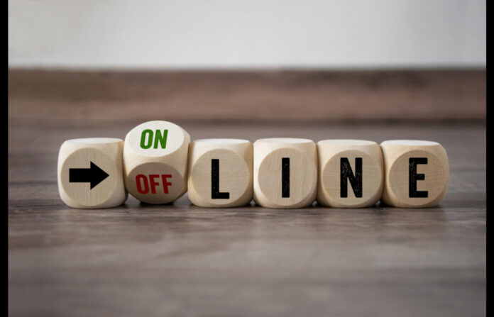Offline and online written in cubes with arrow sign