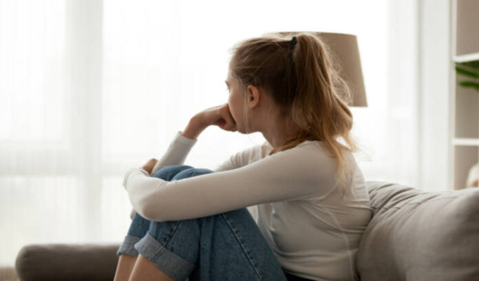 Woman sitting on couch