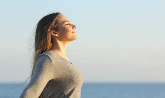 Woman breathing fresh air