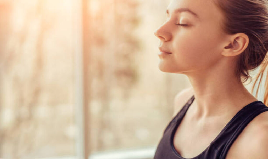 Woman doing breathing exercises
