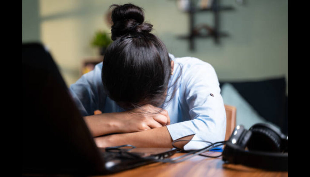 young-business-woman-sleeping-by-laptop