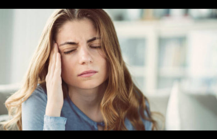 Women having migraine