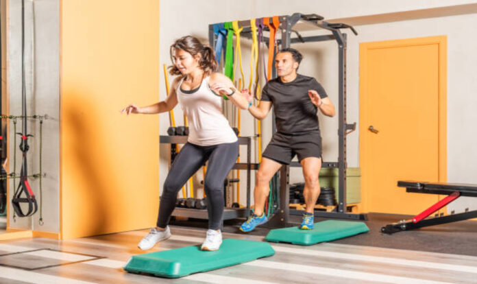 Woman and men doing lateral jump