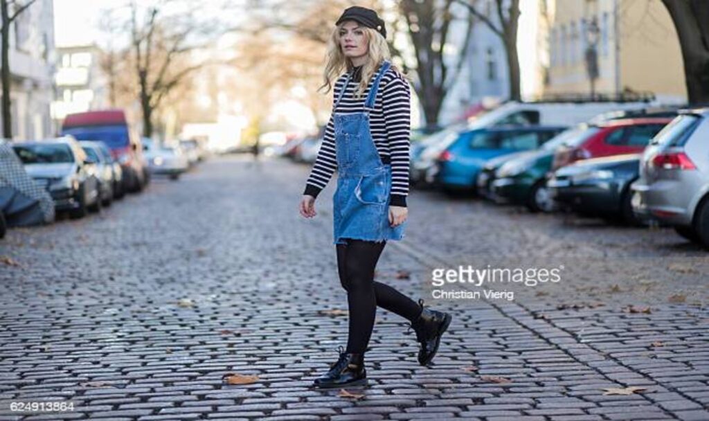 Woman wearing overall dress