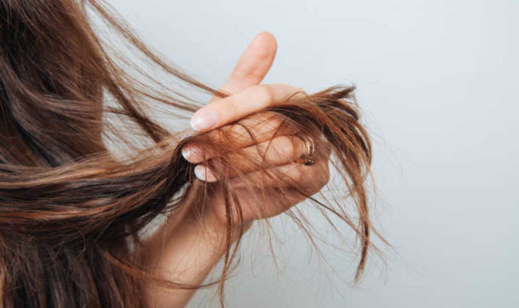 Girl holding her hair