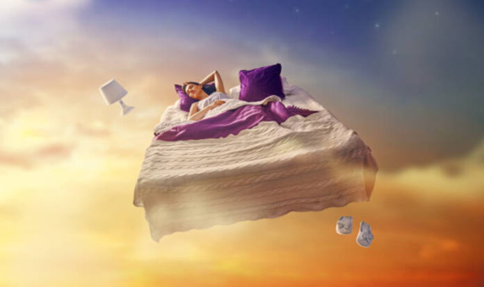 Girl flying in her bed
