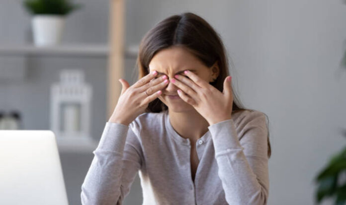 Girl rubbing her eyes