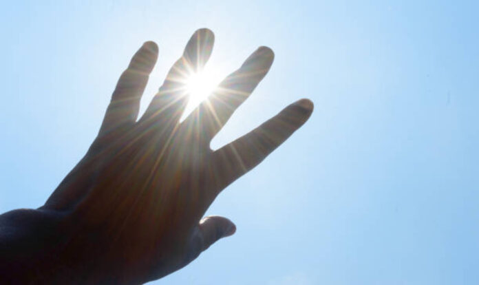 Hot summer sunlight and hands covering them