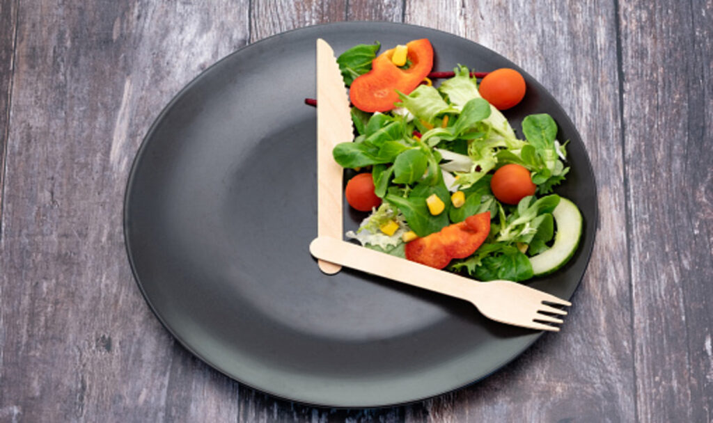 Intermittent fasting food on galf side of plate