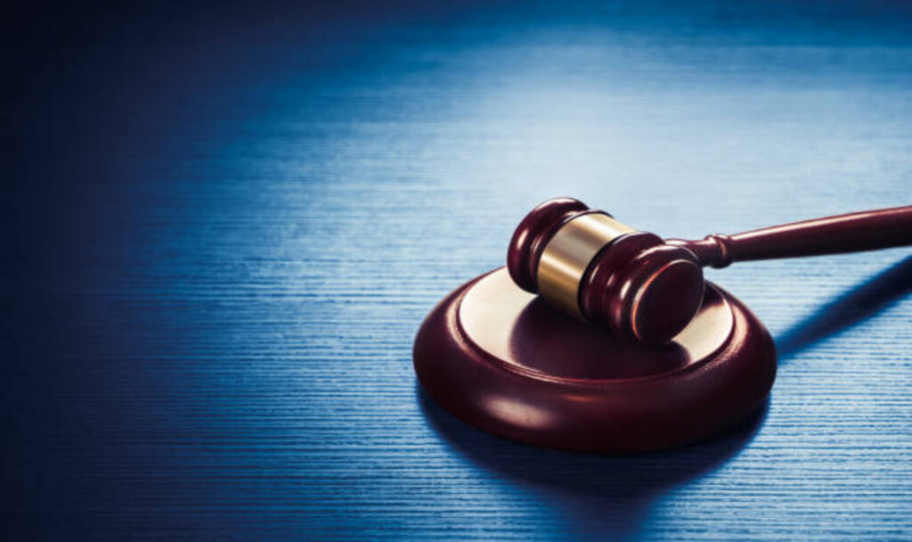 Gavel on blue background