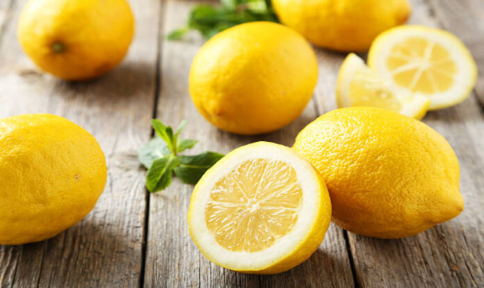 Lemons on wooden background