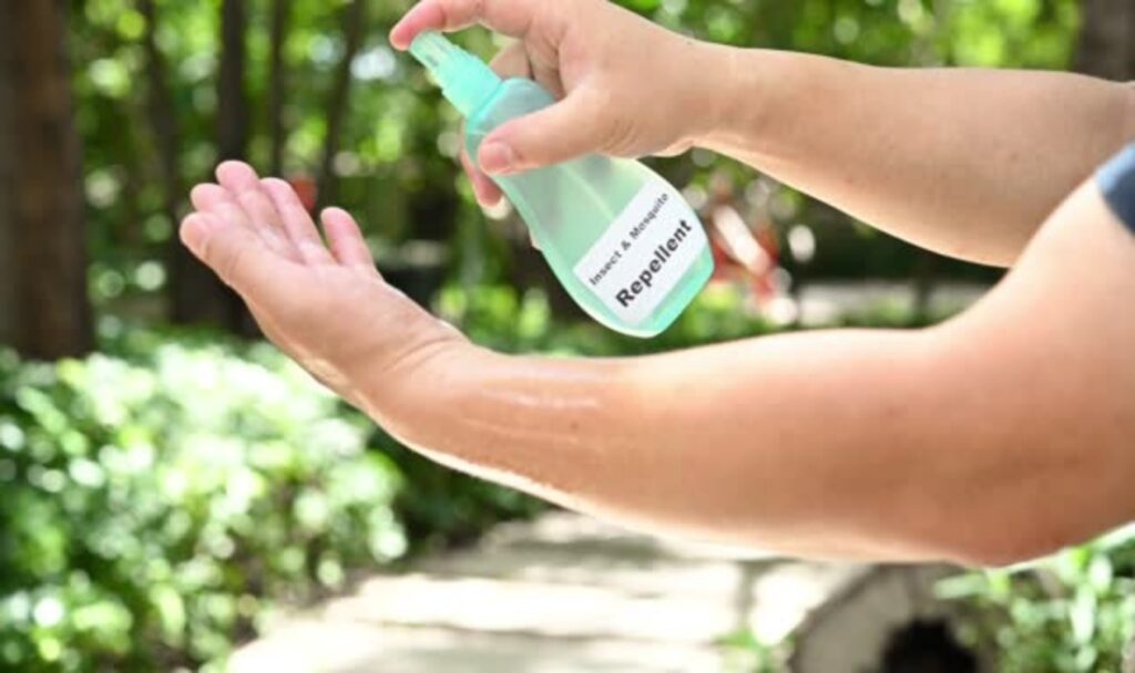 man-spraying-insect-and-mosquito-repellent-to-his-hand