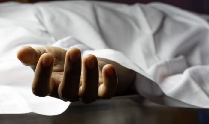 Person lying dead with outstretched hand