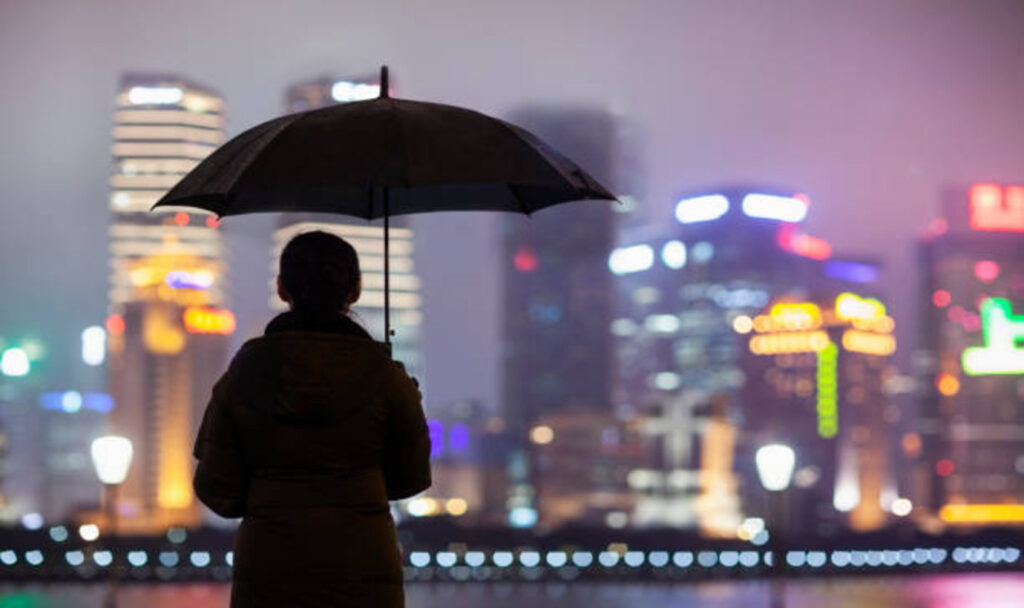 Woman standing in rain