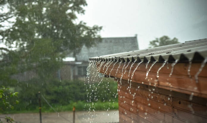 Rain water flows down roof