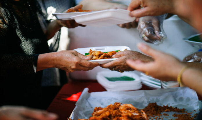 Hands giving food