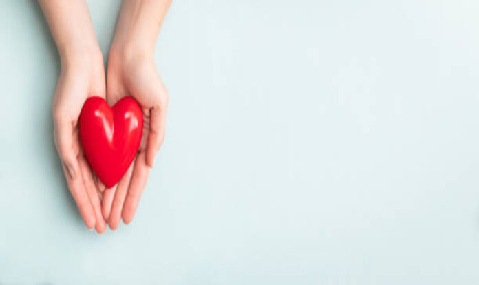 Woman holding red heart