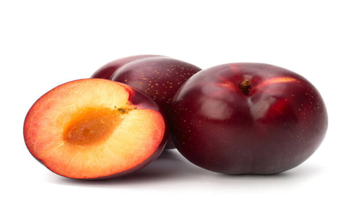 Three red plum on white background