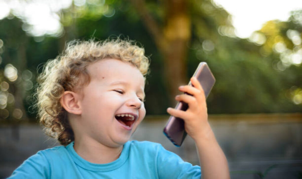 toddler-boy using phone