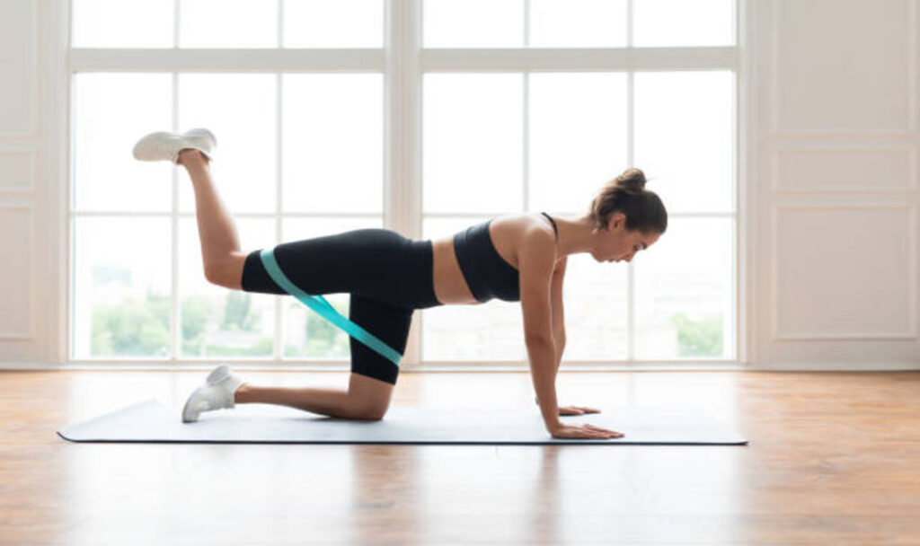 woman-doing-donkey-kicks-exercise