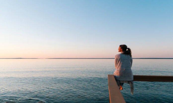 Woman sitting on edge enjoying view