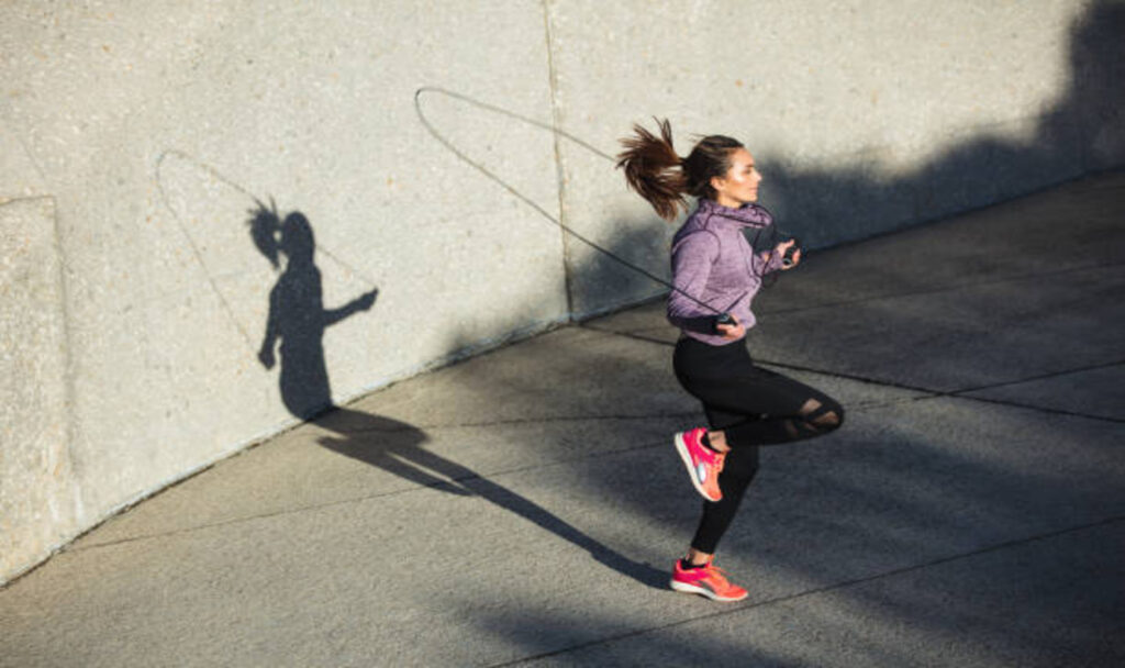 Woman skipping ropes