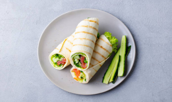 Vegetable wrap with cucumber sides