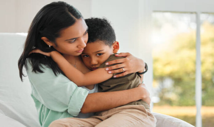young-mother-holding-her-boy