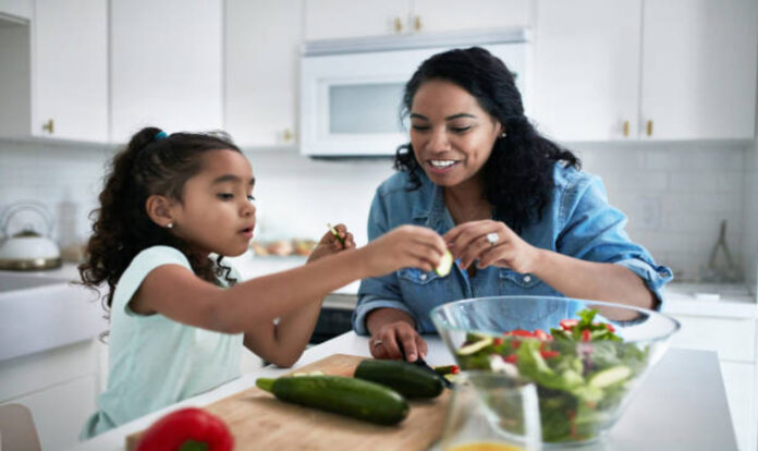 Girl and mother cooking Together