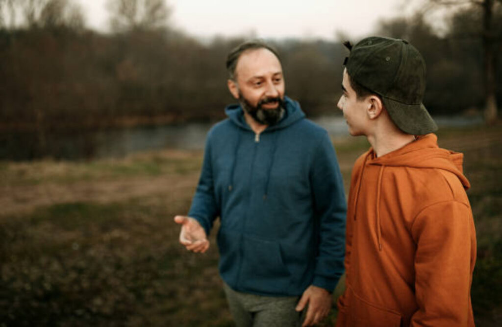 Dad and son talking