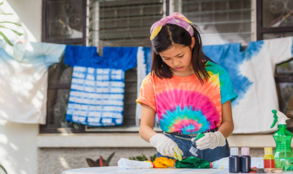 Girl making tie dye tshirt